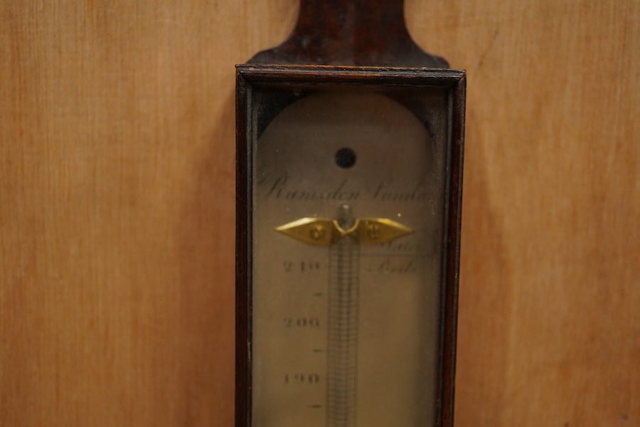 A George III mahogany cased thermometer by Ramsden, London, with silvered scale, height 46cm. Condition - poor to fair, the majority of the mercury now missing and reattachment needed to the top of the case.